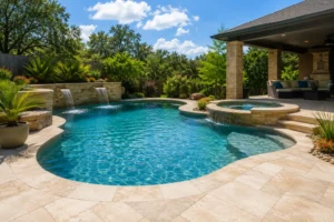 Freeform pool and spa beside a covered patio