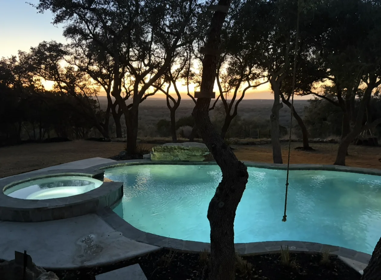 Swimming pool and spa at dusk in the Texas Hill Country